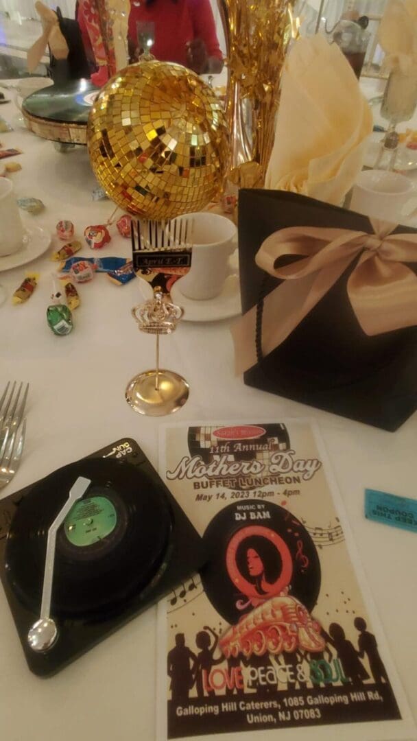 A table with a box of chocolates and a record player.