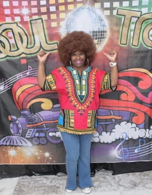 A woman with an afro and a red shirt