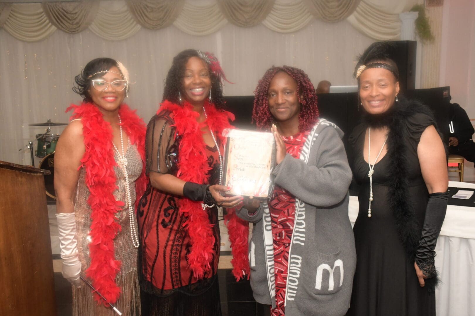 A group of women holding up a certificate.