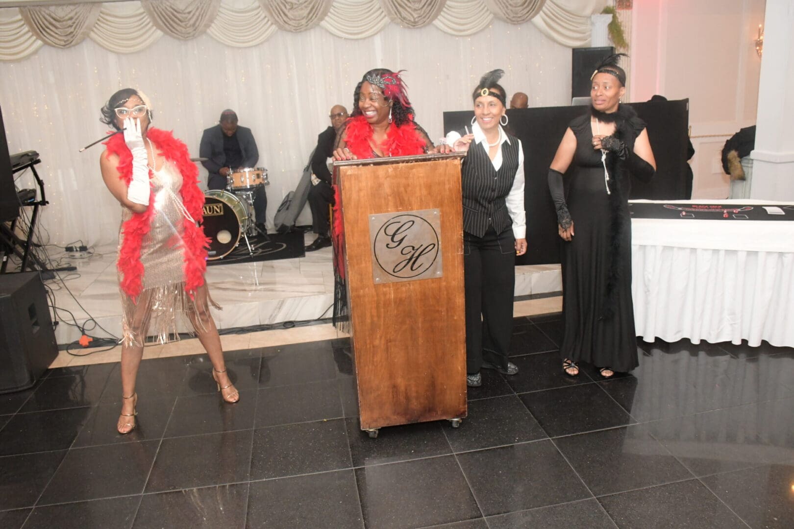 A group of women standing at a podium.