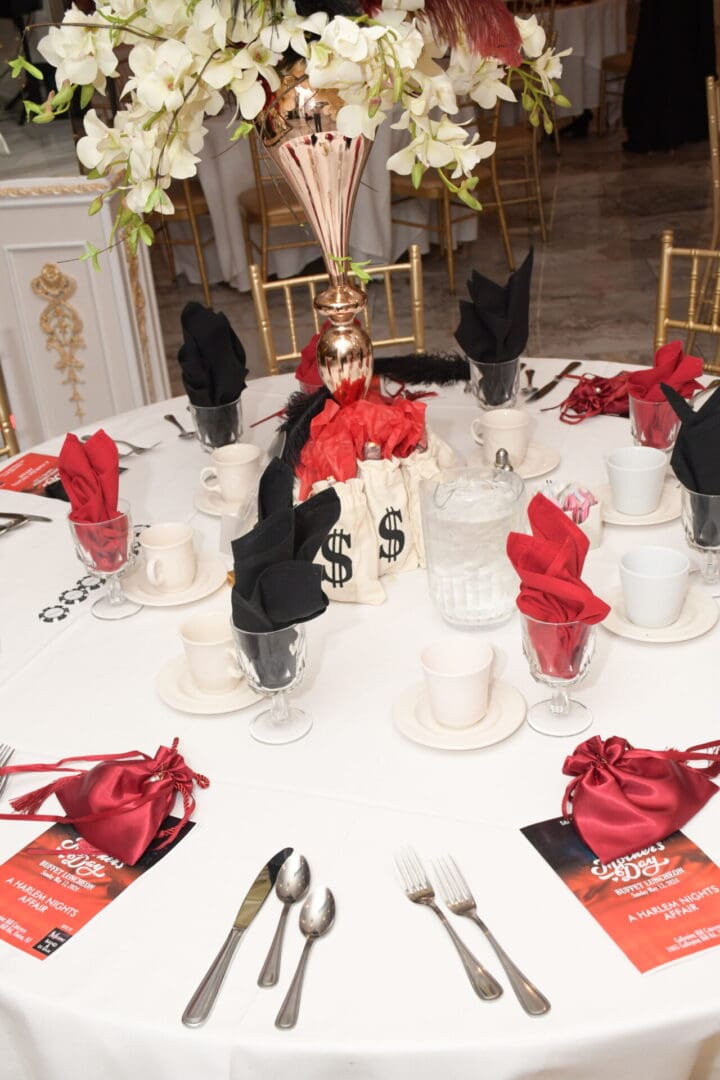 A table set with red and black napkins