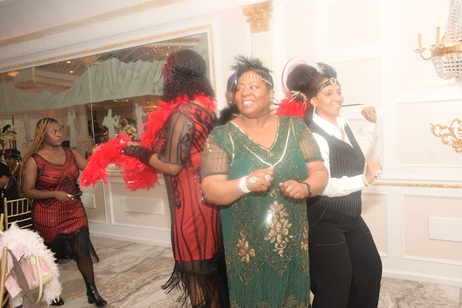 A group of women standing around in costumes.