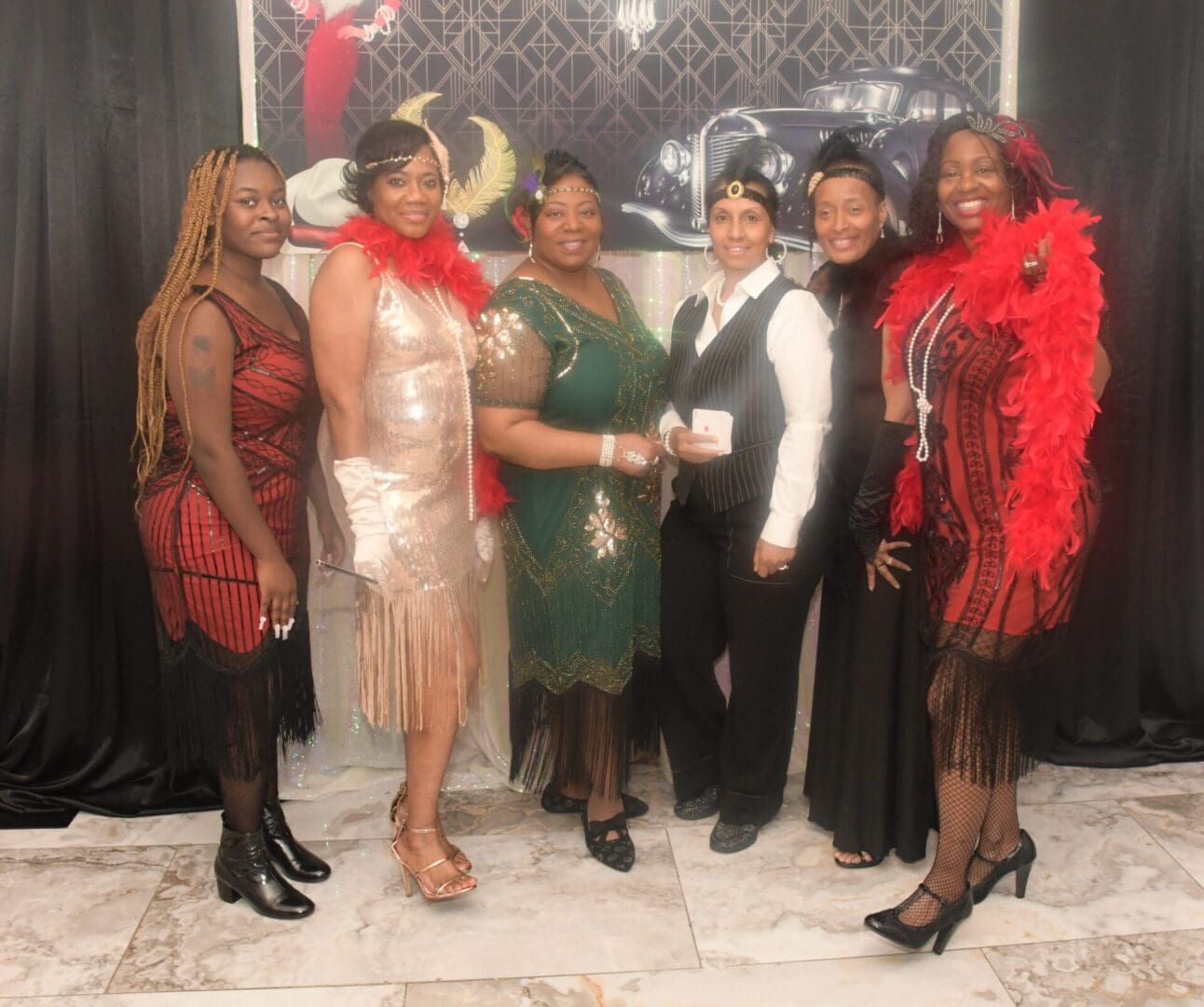 A group of women in fancy dresses posing for the camera.