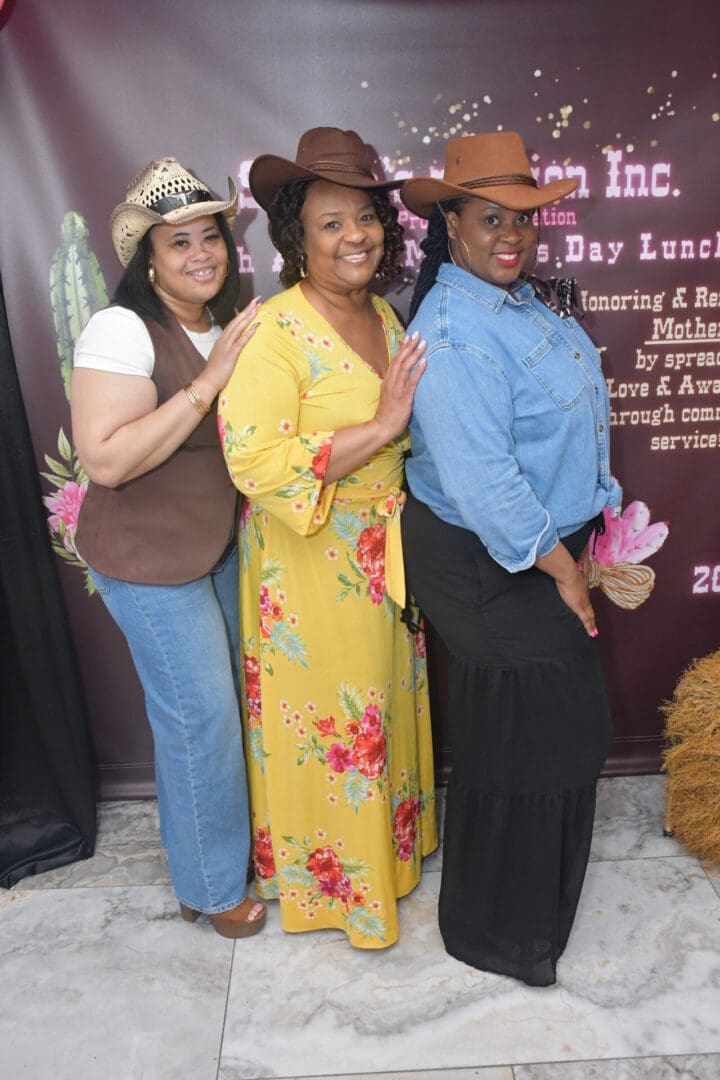 Three women posing in cowboy hats.