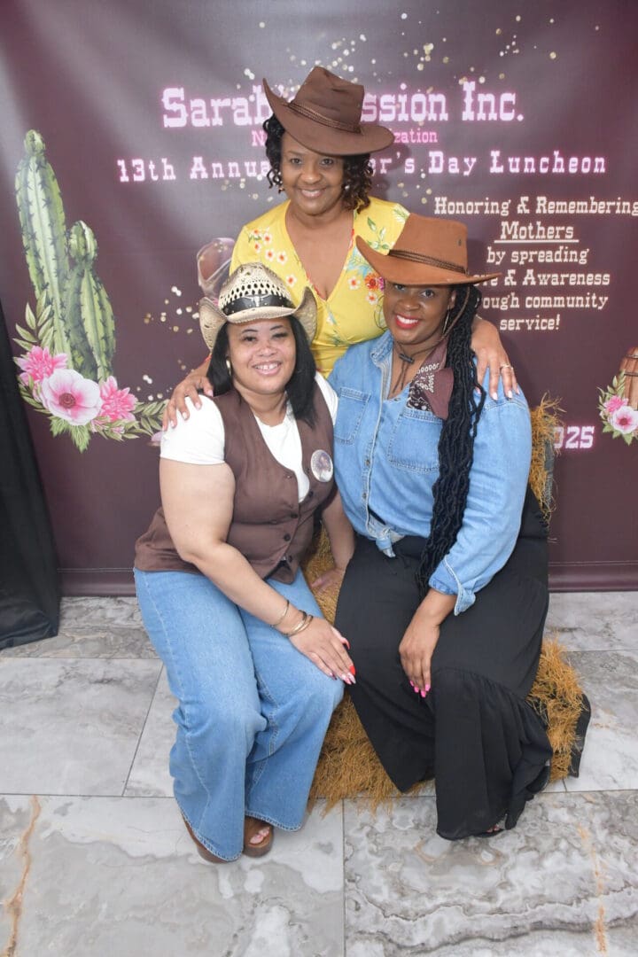 Three women posing in cowboy hats.