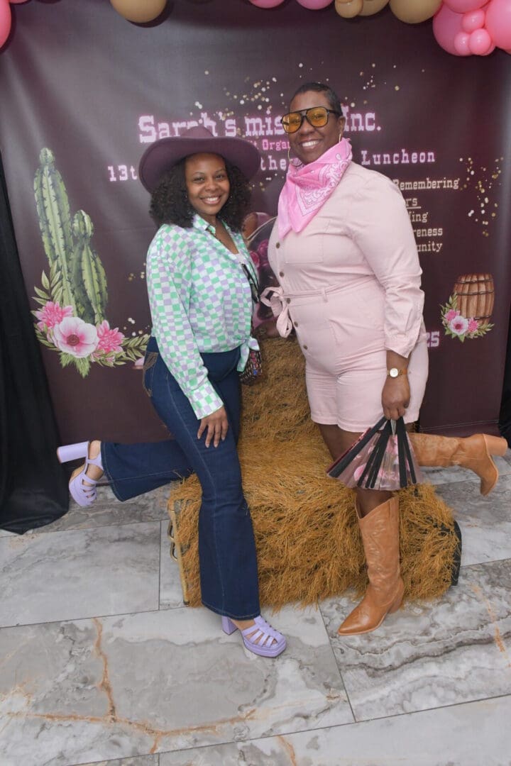 Two women posing in western-themed outfits.