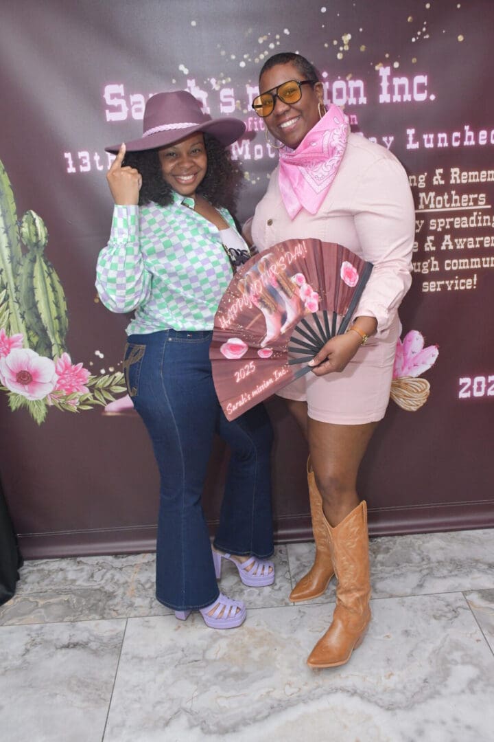 Two women posing in festive attire.