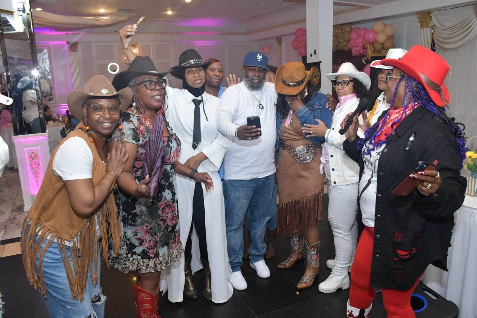 Group of people in cowboy-themed attire.