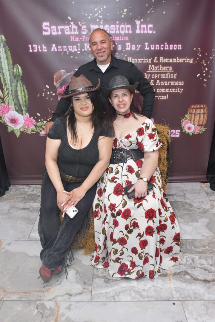 Three people posing at themed event.