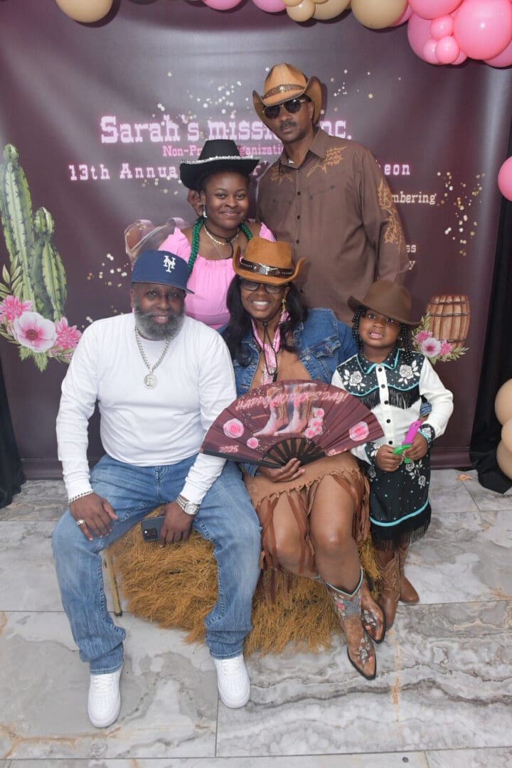 Family in cowboy-themed outfits at an event.