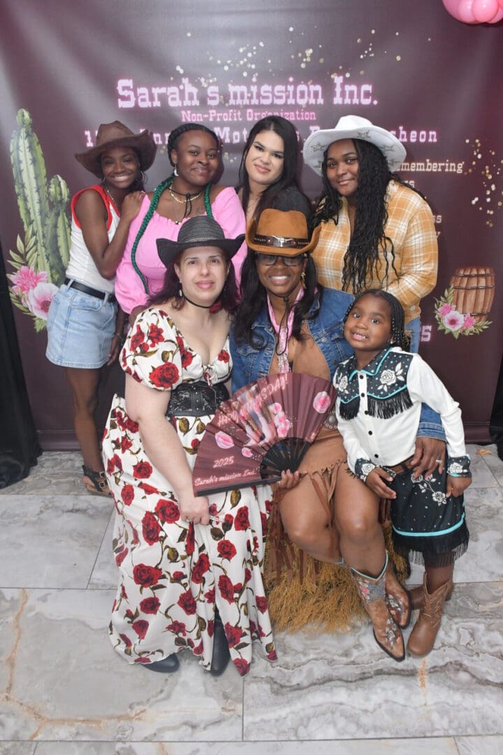 Group posing in Western-themed attire.