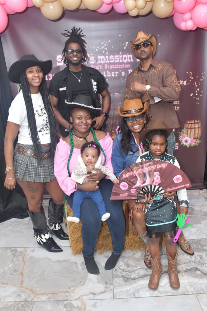 Group photo in cowboy-themed attire.