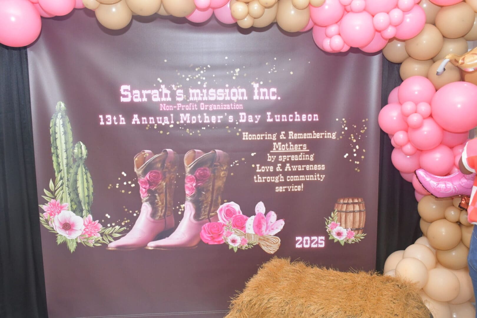 Cowboy boots and balloons Mother's Day backdrop.