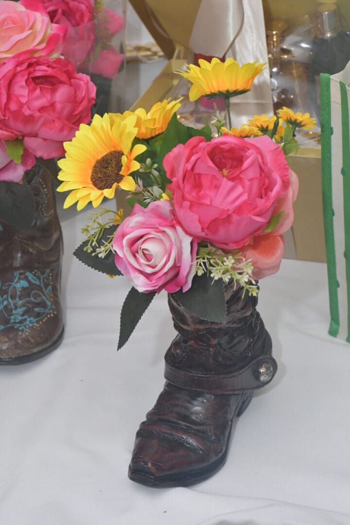 Boot vase with colorful flowers arrangement.