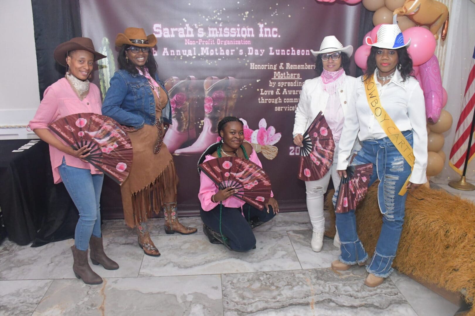 Women posing at Mother's Day luncheon event.