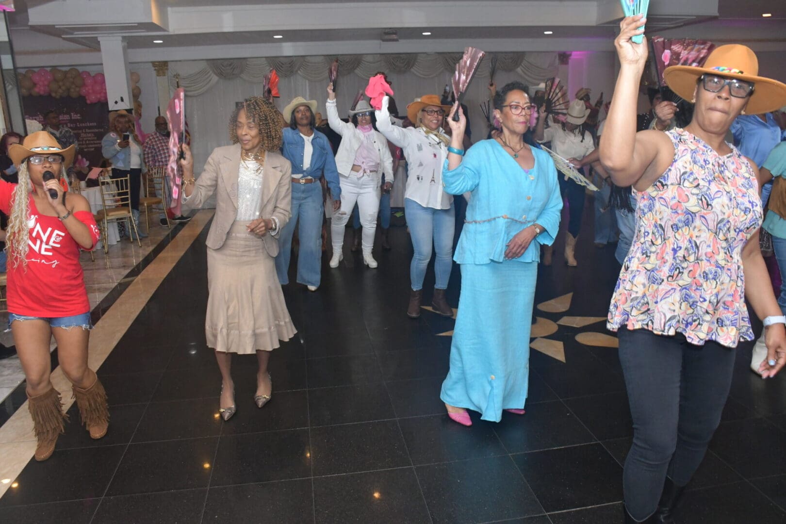 People dancing at a lively indoor event.