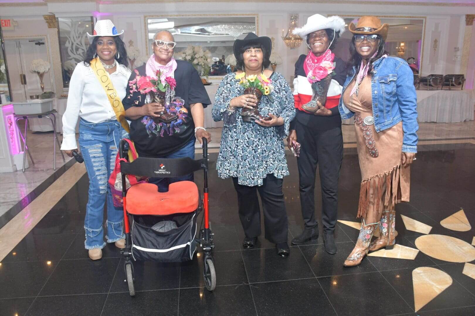 Group of people wearing cowboy-themed outfits.